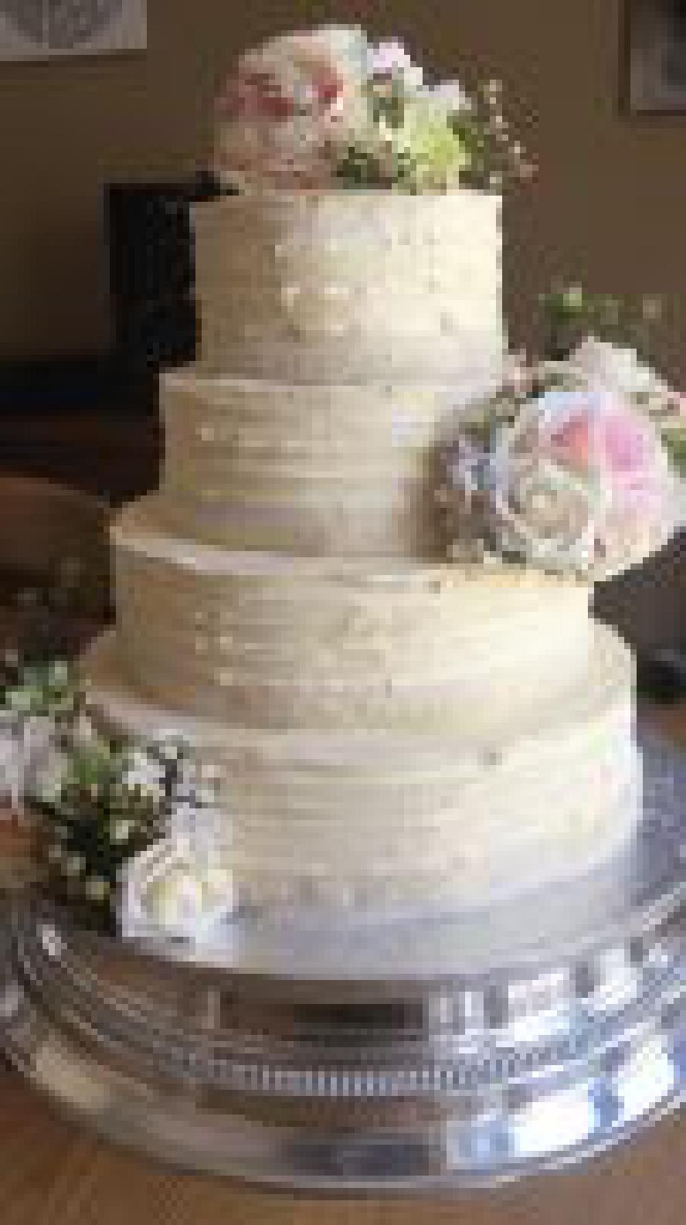 Buttercream cake with silk flowers